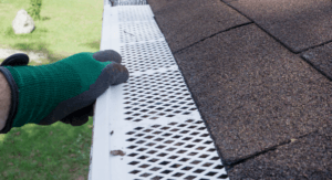 Preparing gutter guards for storm.
