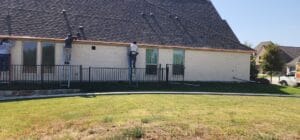 man installing gutters