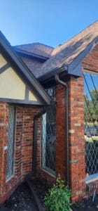 gutter and downspout on brick wall